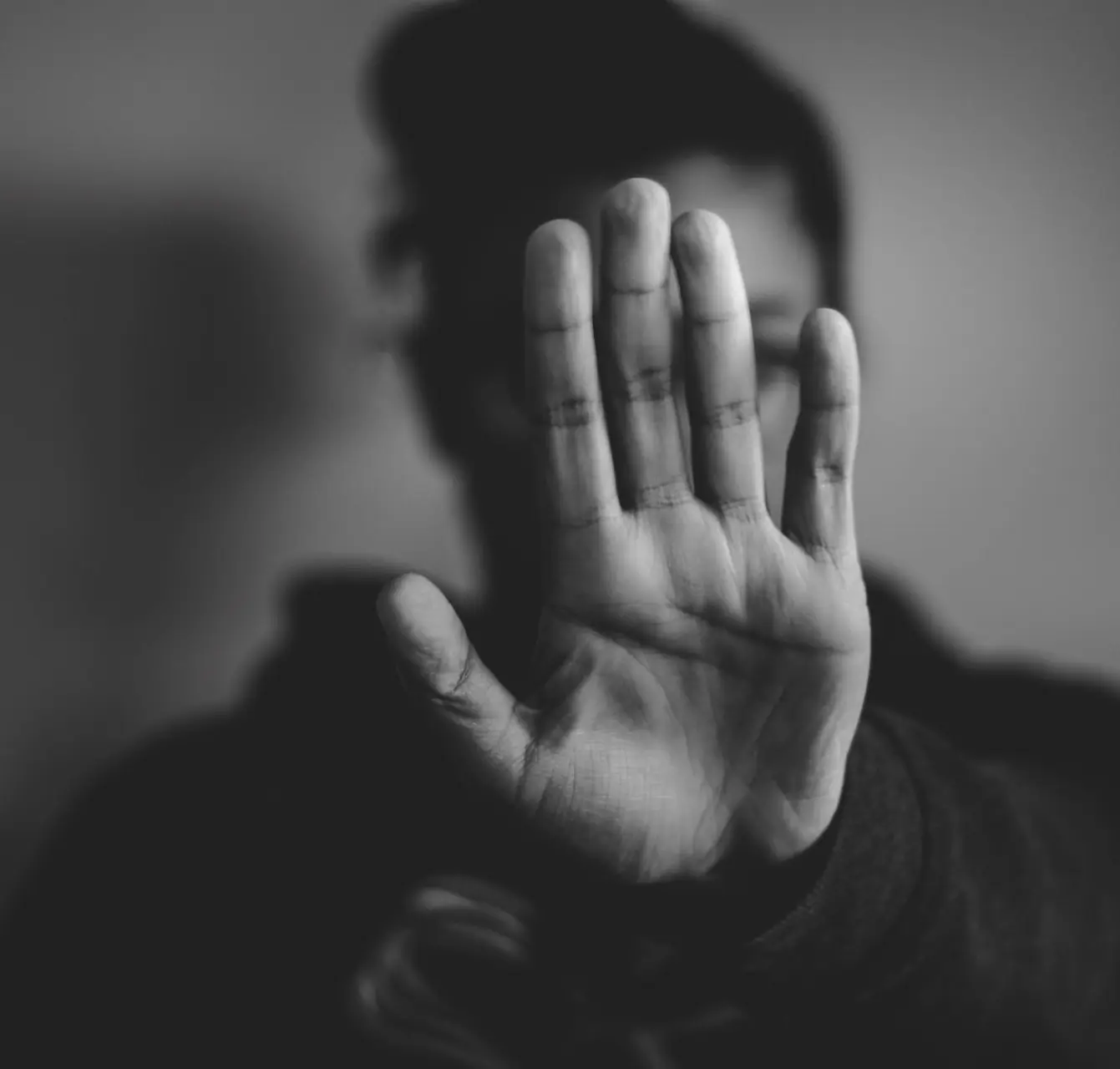 close-up photography of person lifting hands